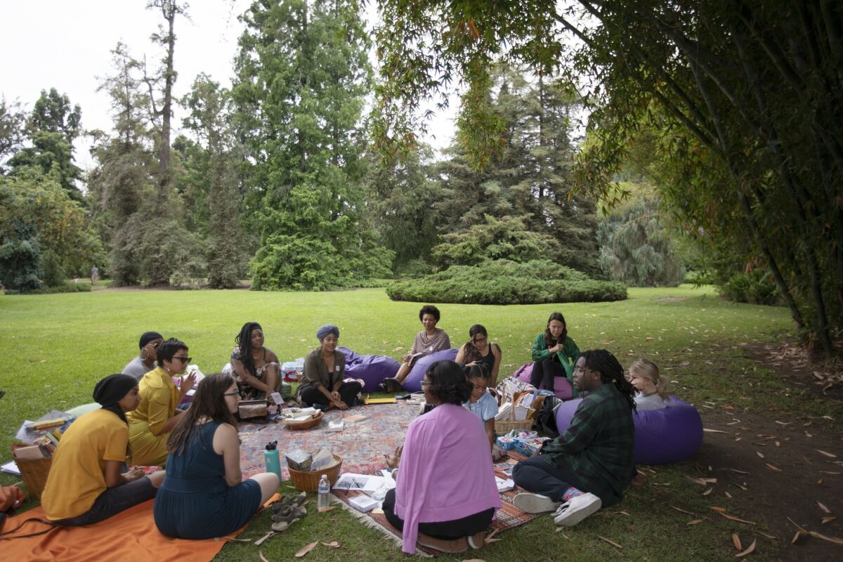 Asha Grant and others gather in a field outside the Huntington Library as part of the Free Black Women's Library.