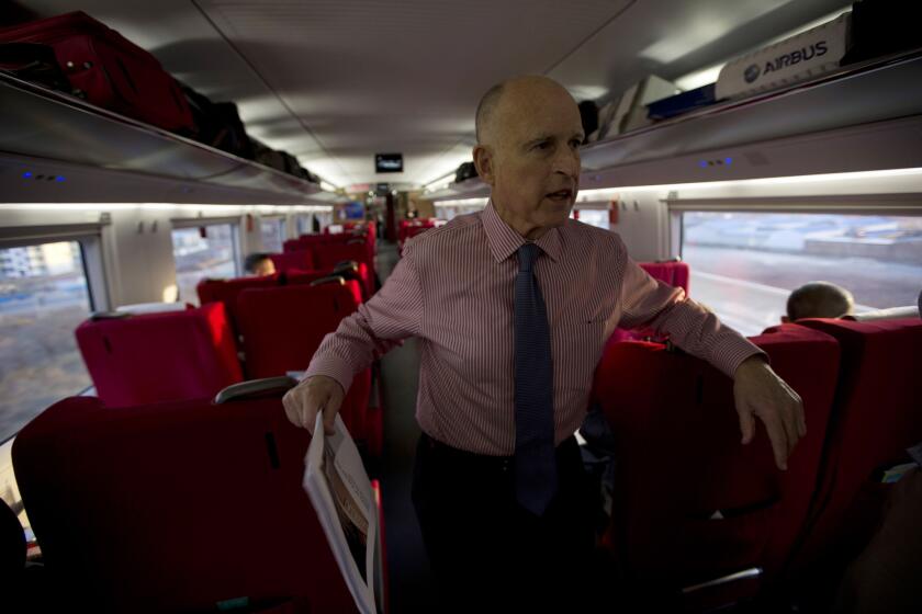 This year's state budget includes high-speed rail as an important part of California's landmark effort to reduce greenhouse gas emissions and fight climate change. Above: California Gov. Jerry Brown speaking to journalists from a high-speed train in China in 2013.