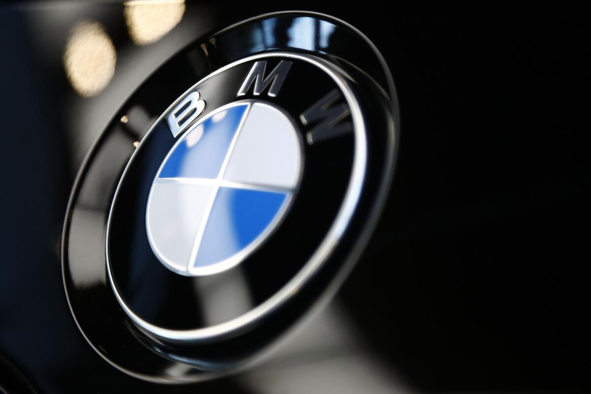 FILE- The logo of BMW is shown on a BMW car on March 20, 2019 in Munich, Germany. BMW is recalling more than 917,000 cars and SUVs in the U.S., Wednesday, March 9, 2022, most for a third time _ to fix a problem that can cause engine compartment fires. The recall covers many 3 Series, 5 Series, 1 Series, X5, X3, and Z4 vehicles from 2006 through 2013. (AP Photo/Matthias Schrader)