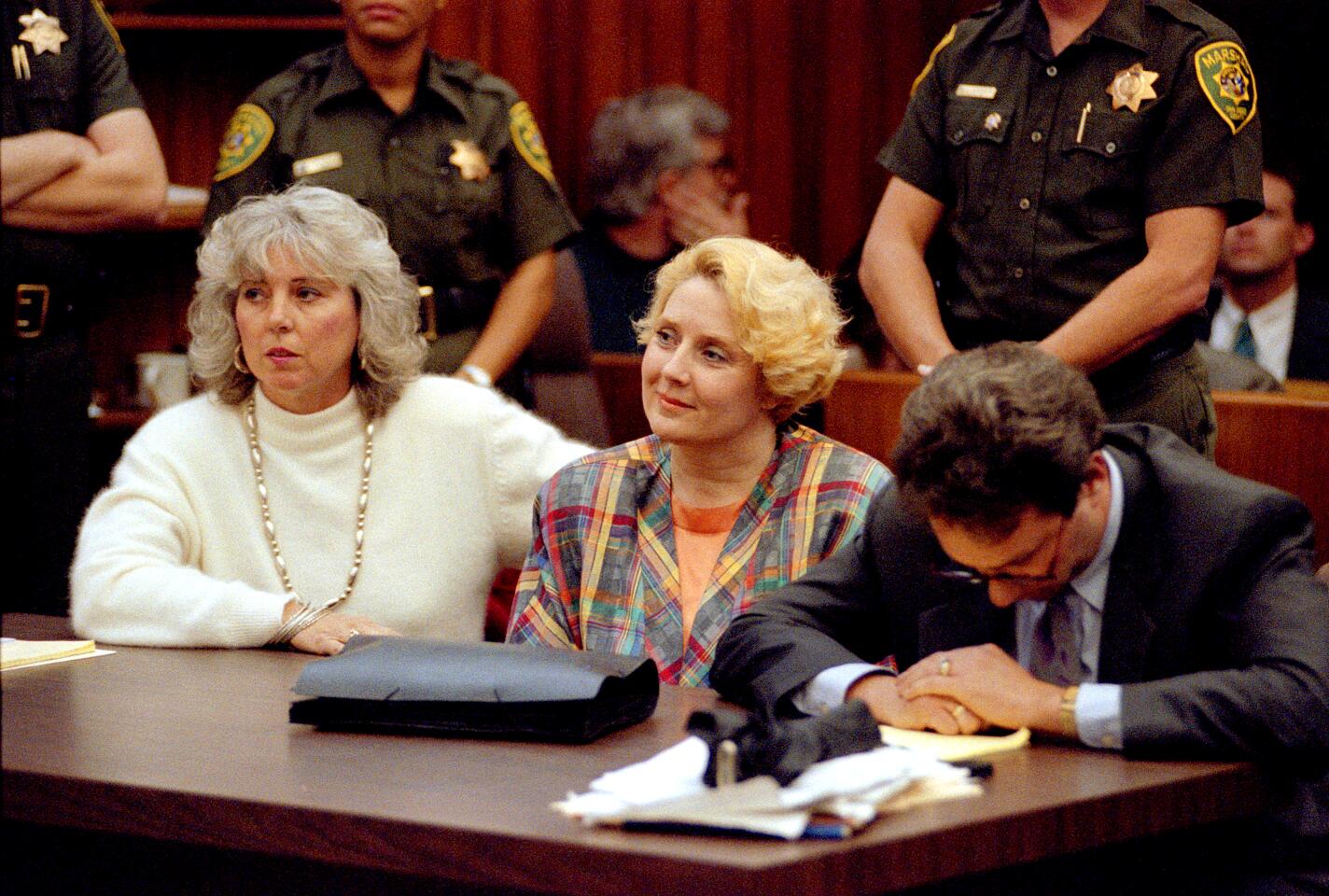 Betty Broderick smiles as the jury reads its verdict on Dec. 10, 1991. Her attorney, Jack Earley, reacts differently.