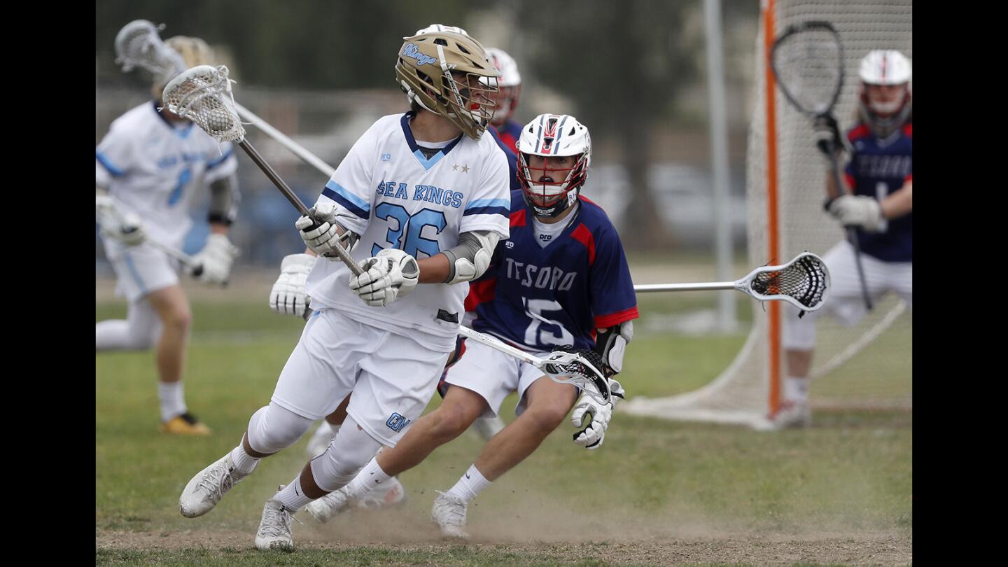 Corona del Mar High's Ryan Rector, left, competes against Tesoro during the first half in a nonleague game on Saturday, March 31.