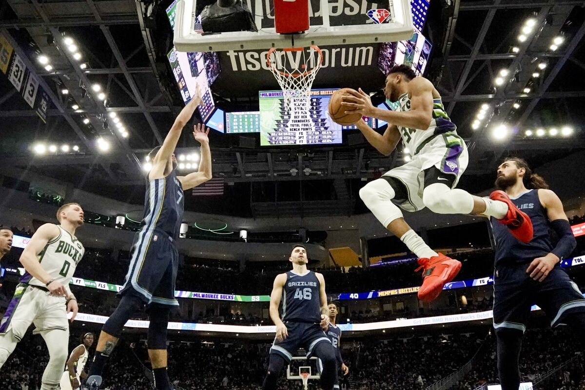 Milwaukee Bucks' Giannis Antetokounmpo looks to shoot during the first half of an NBA basketball game against the Memphis Grizzlies Wednesday, Jan. 19, 2022, in Milwaukee. (AP Photo/Morry Gash)