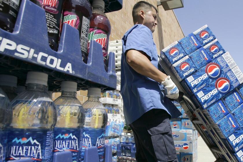 PepsiCo Inc. announced Friday that it would spend $5 billion to expand in Mexico. Above, Pepsi products being delivered to a Nebraska store in 2008.