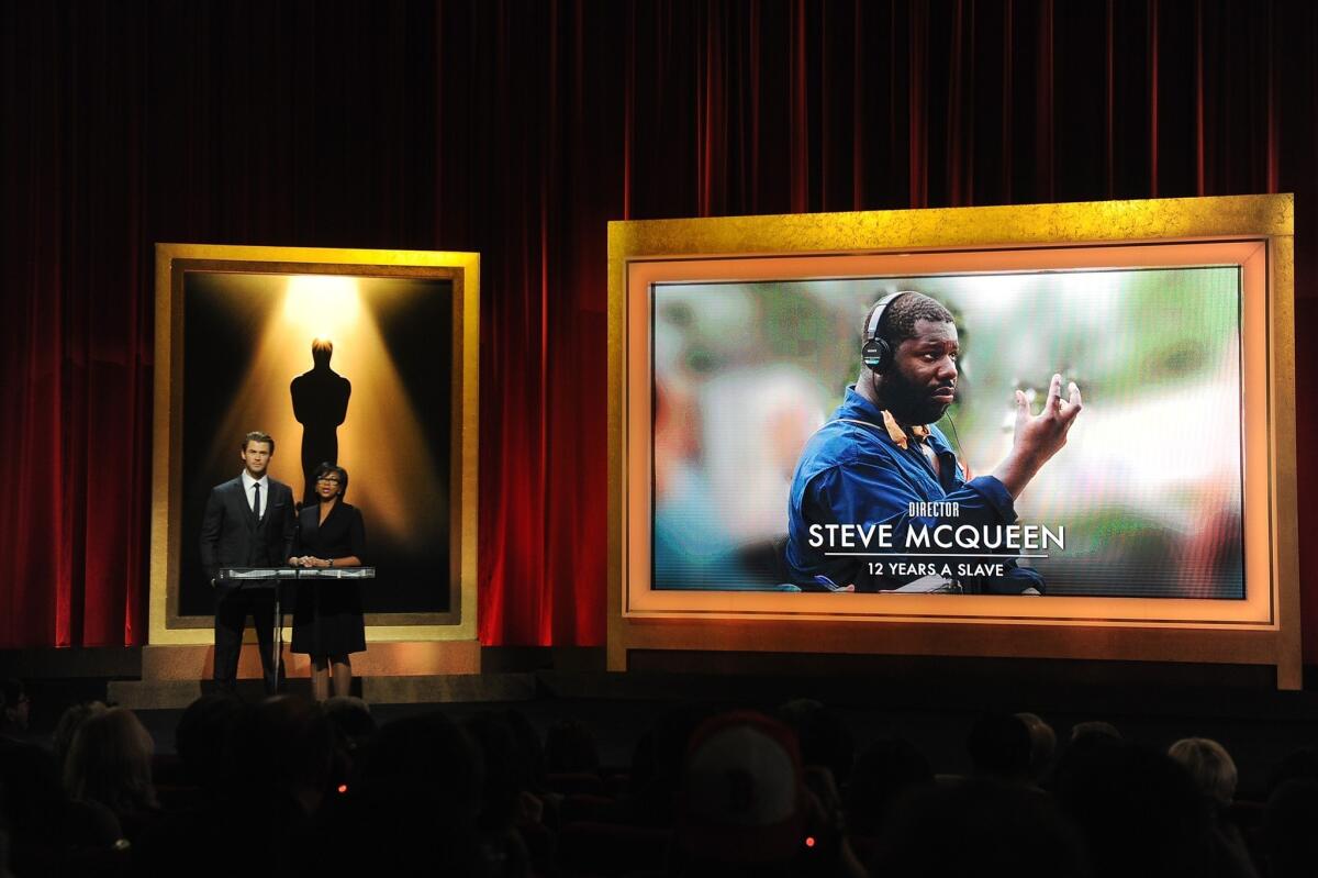 Chris Hemsworth and Academy President Cheryl Boone Isaacs announce Steve McQueen as a nominee for best director for "12 Years a Slave."