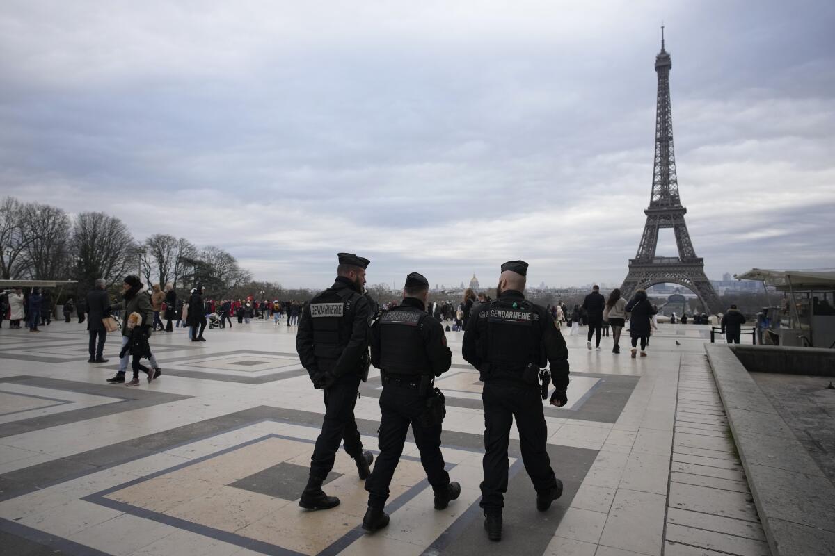 French gendarmes patrolling near the Eiffel Tower