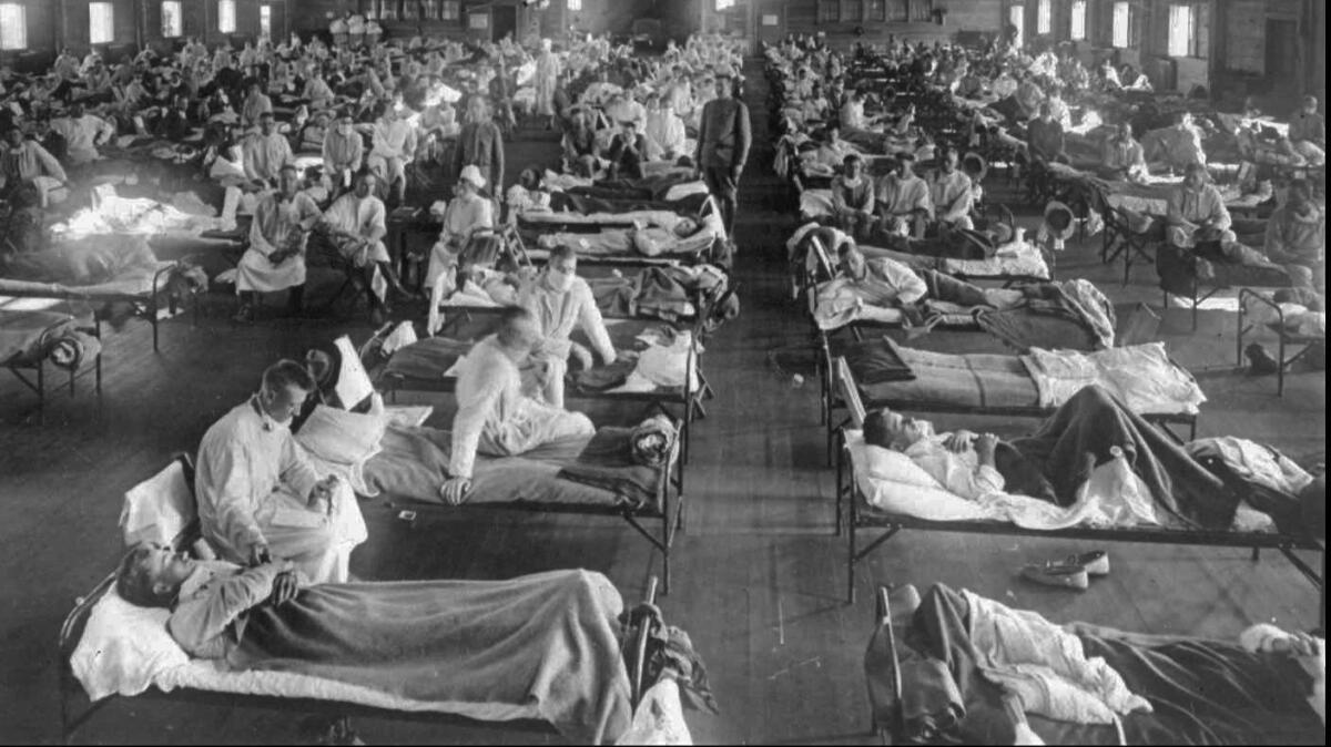 Influenza victims crowd an emergency hospital near Fort Riley, Kan., in this 1918 photo.