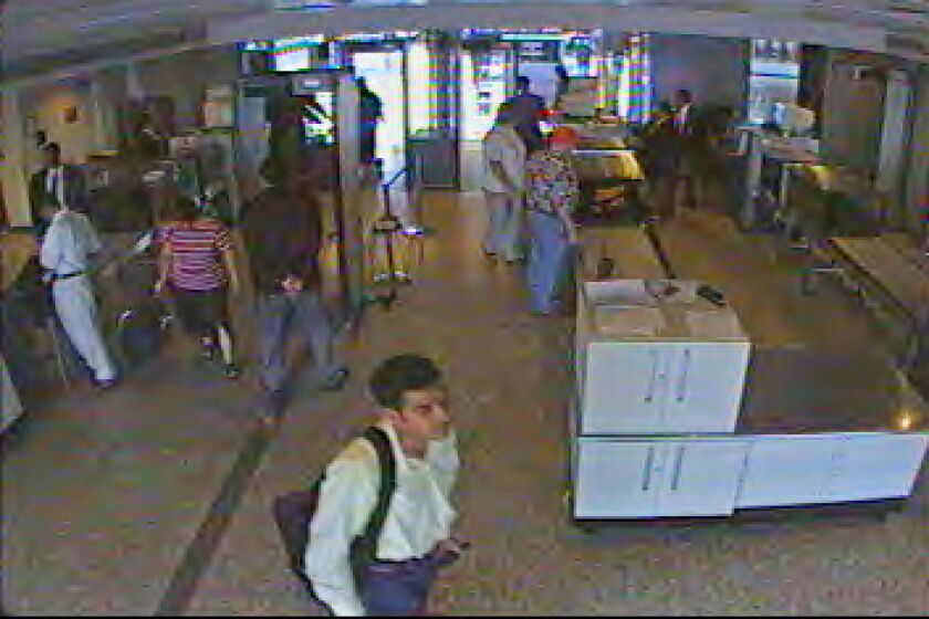 Khalid al-Mihdhar passes through security at Dulles International Airport in Chantilly, Va., on Sept. 11, 2001