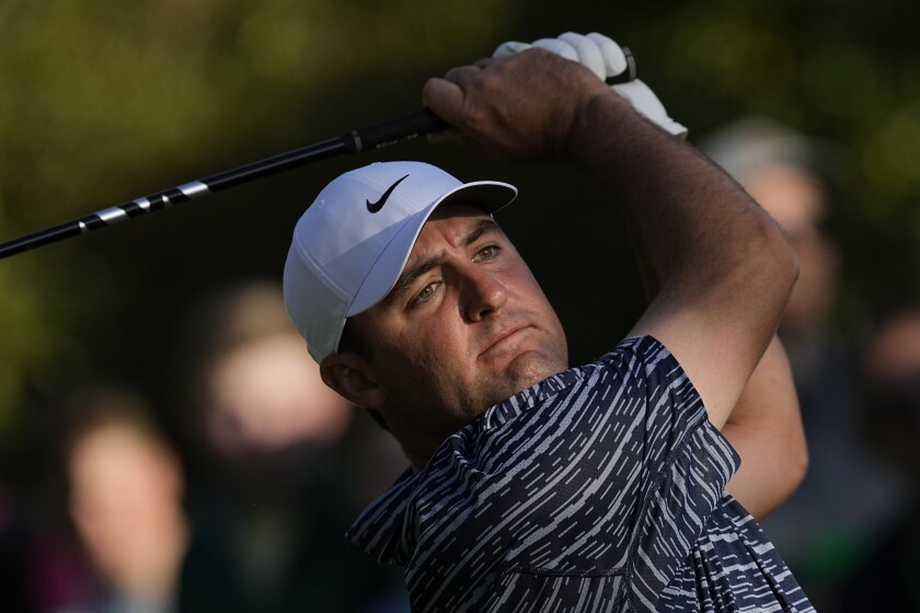 Scottie Scheffler tees off on the 15th hole during the final round at the Masters golf tournament on Sunday, April 10, 2022, in Augusta, Ga. (AP Photo/Robert F. Bukaty)