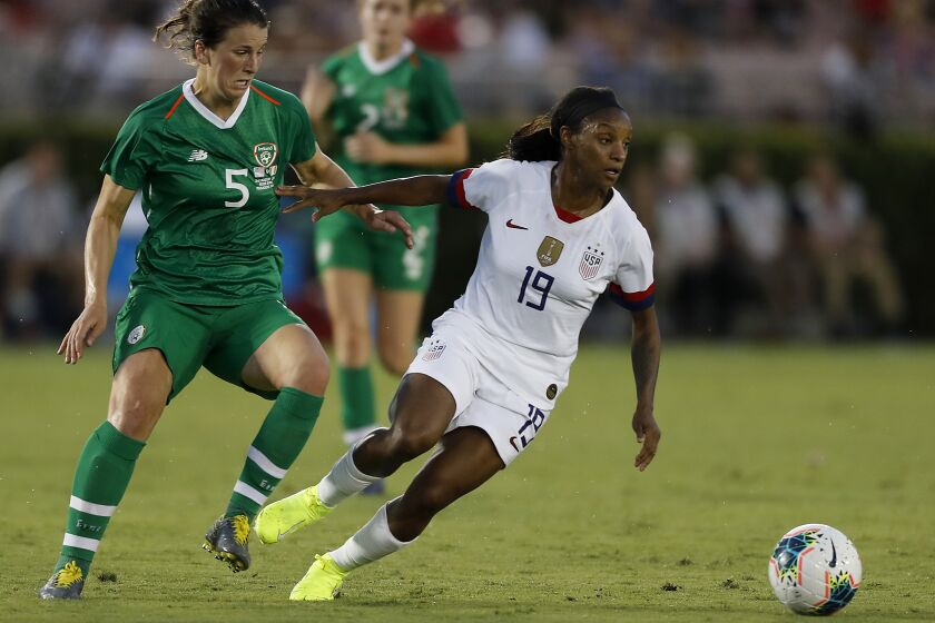 U.S. defender Crystal Dunn dribbles past Ireland defender Niamh Fahney during a match at the Rose Bowl in Pasadena. 