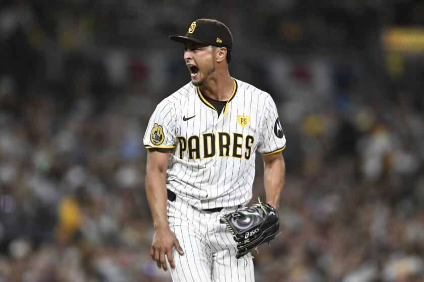 San Diego Padres starting pitcher Yu Darvish reacts after striking out St. Louis Cardinals' Michael Siani during the seventh inning of a baseball game Tuesday, April 2, 2024, in San Diego. (AP Photo/Denis Poroy)
