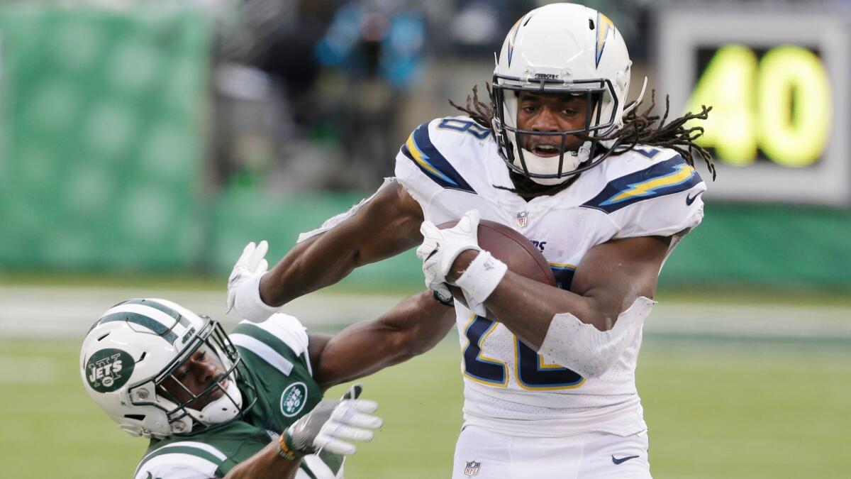 Chargers running back Melvin Gordon breaks a tackle by New York Jets' Marcus Maye on Dec. 24.