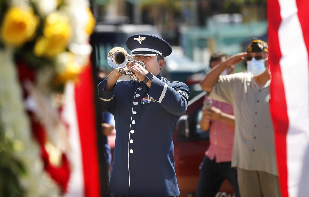 A trumpet is played at a Memorial Day event.