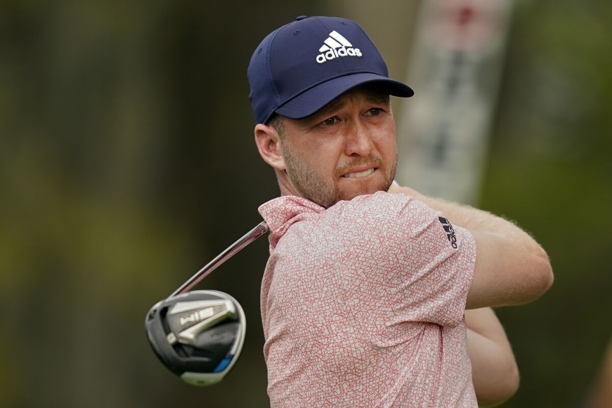 Daniel Berger hits from the tee on the 14th hole during the final round of play in The Players Championship golf tournament Monday, March 14, 2022, in Ponte Vedra Beach, Fla. (AP Photo/Gerald Herbert)