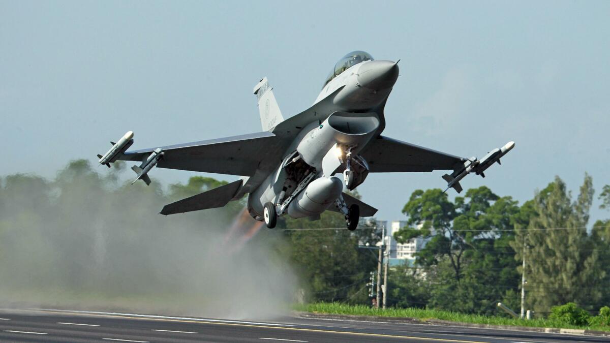 A Taiwanese air force F-16 fighter jet takes off from a closed section of highway during the annual Han Kuang military exercises in the southwestern city of Chiayi in September 2014.