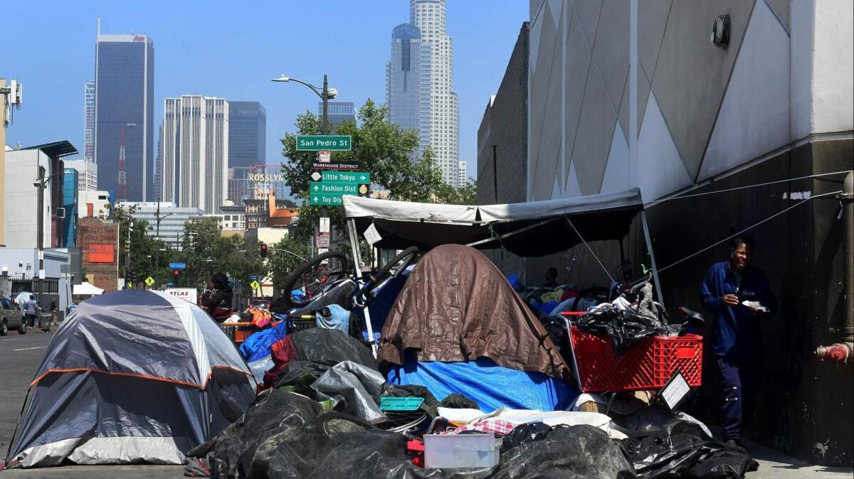Belongings of the homeless population fill a downtown Los Angeles sidewalk in skid row on May 30.