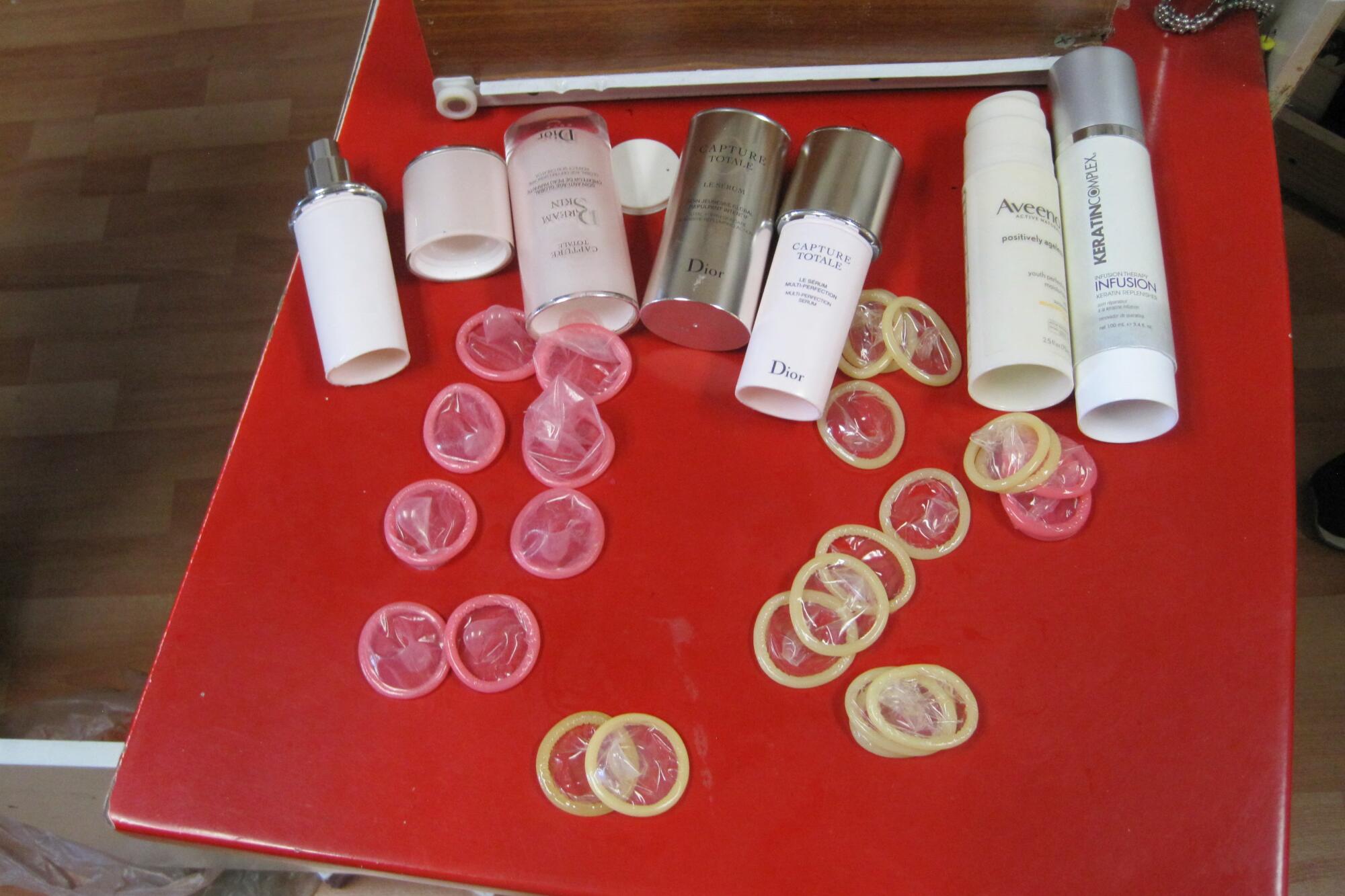 Condoms hidden in lotion bottles with false bottoms at one of Mei Xing's massage parlors.