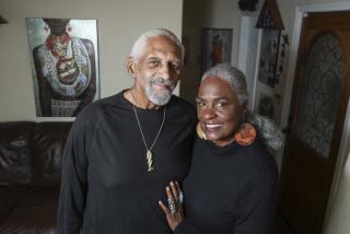 John and Renee Phillips pose for a photo in their San Diego home on Feb. 12, 2021.  