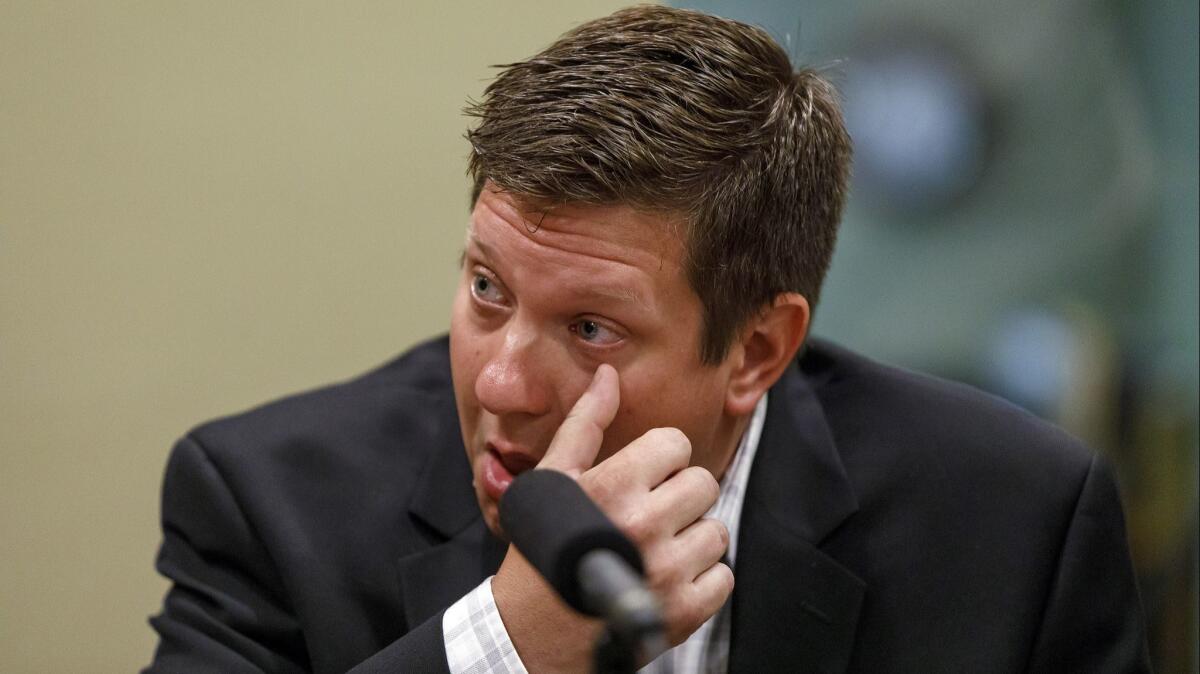 Chicago Police Officer Jason Van Dyke speaks with reporters at his lawyer's office on Aug. 28.