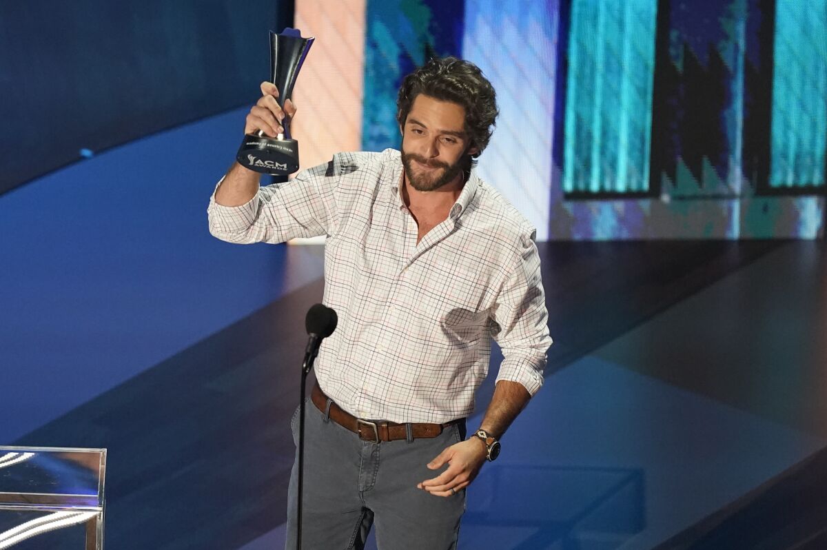 Thomas Rhett accepts the entertainer of the year award