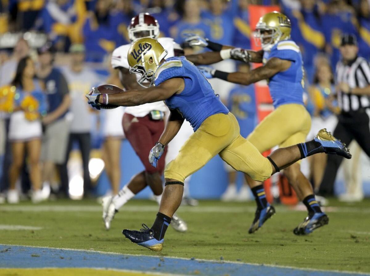 UCLA's Jordon James, shown here scoring a touchdown this season, will miss this weekend's game.