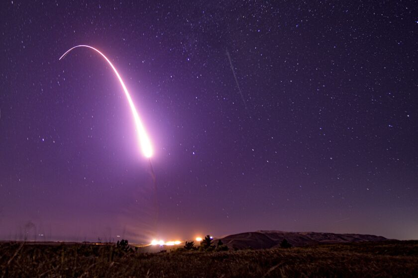 This image taken with a slow shutter speed and provided by the U.S. Air Force shows an unarmed Minuteman III intercontinental ballistic missile test launch early Tuesday, Oct. 2, 2019, at Vandenberg Air Force Base, Calif. (Staff Sgt. J.T. Armstrong/U.S. Air Force via AP)