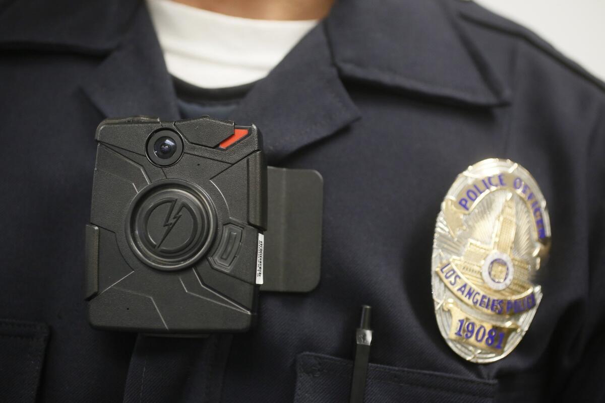 A Los Angeles Police officer wears an on-body camera during a demonstration for media on January, 15, 2014 in Los Angeles. The Burbank Police Department will soon be outfitted with body-worn cameras through a contract with Axon.