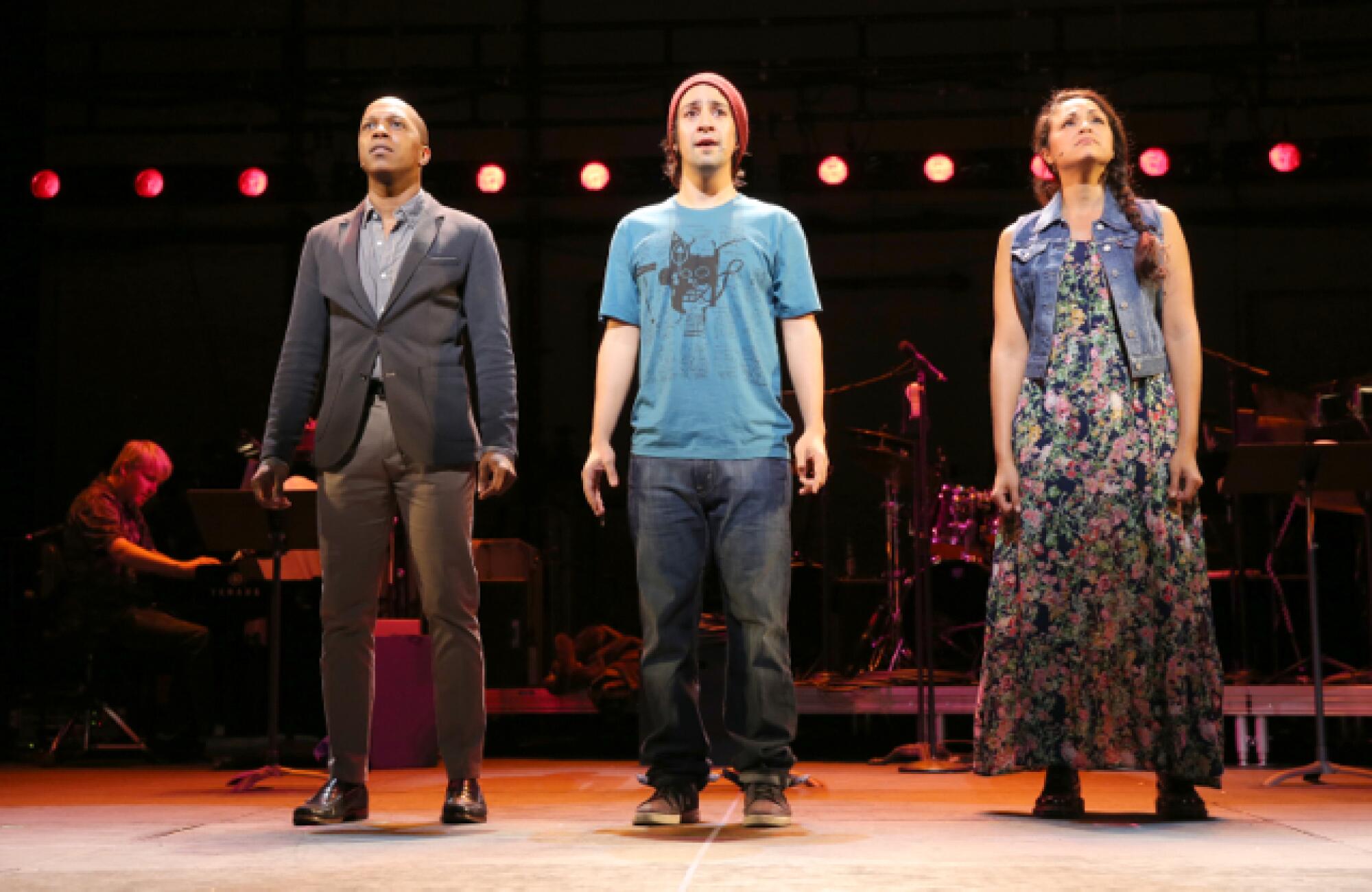 Leslie Odom Jr., Lin-Manuel Miranda and Karen Olivo standing onstage