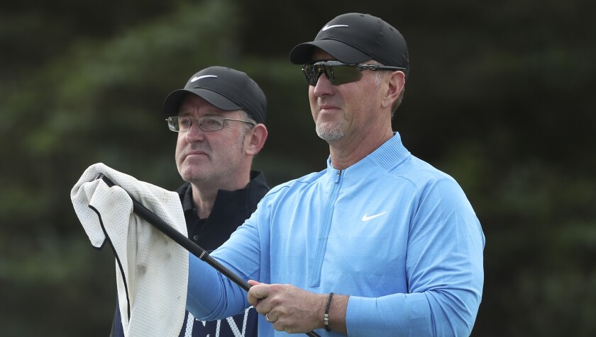David Duval cleans one of his clubs as he wait to play on the fifth tee during the first round of the British Open on Thursday at Royal Portrush in Northern Ireland.