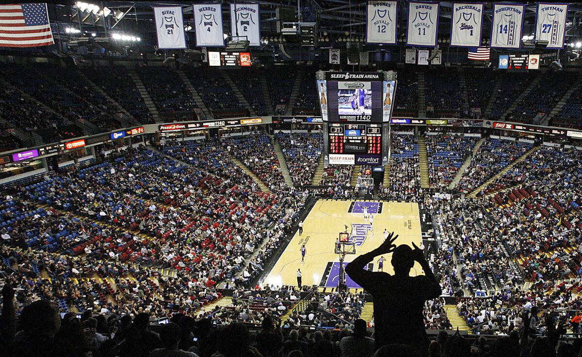 A fan cheers a three-point shot by the Sacramento Kings during a home game against the Phoenix Suns at the Sleep Train Arena.