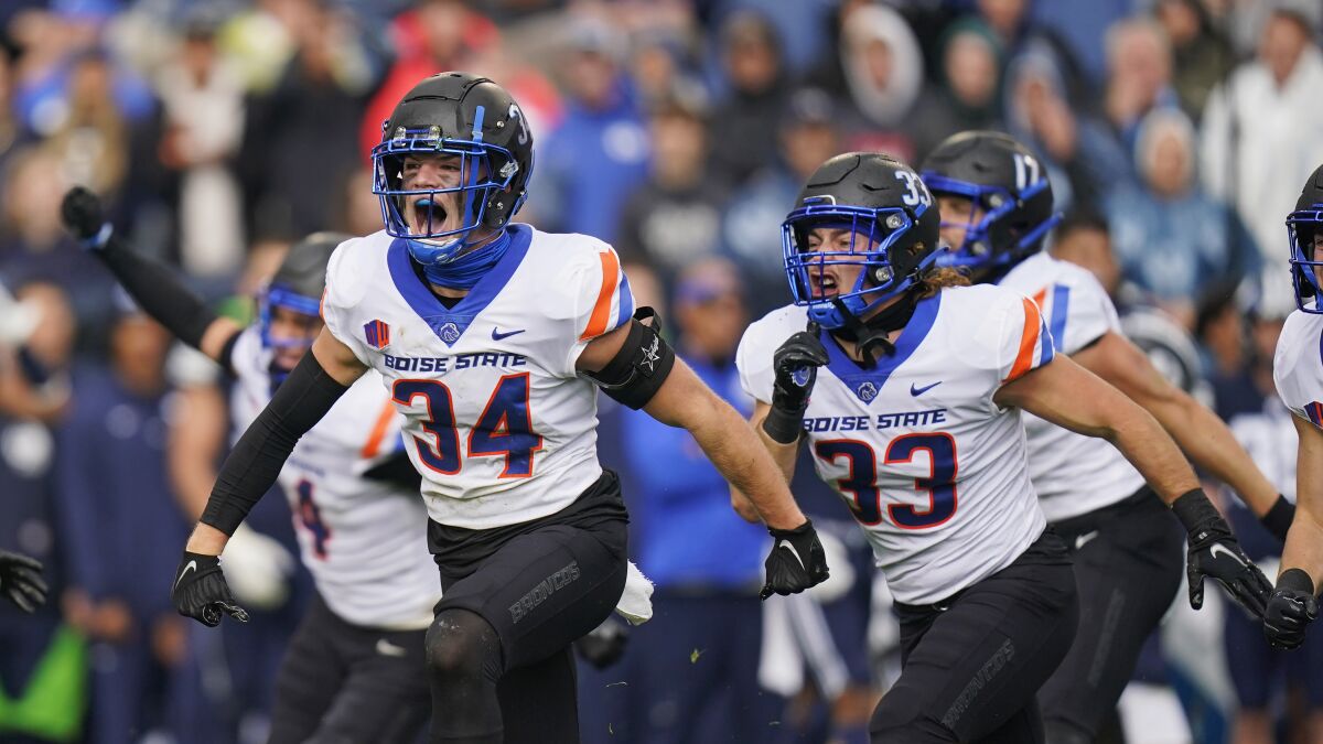 Boise State safety Alexander Teubner (34) celebrates a BYU fumble recovery in the first half during an NCAA college football game Saturday, Oct. 9, 2021, in Provo, Utah. (AP Photo/Rick Bowmer)