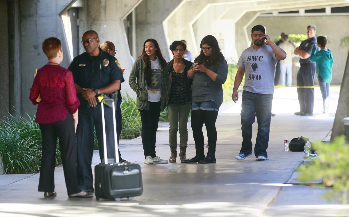 Students at Southwestern College are quarantined (center) away from other students and staff in a hallway after reports of a student with flu-like symptoms prompted an Ebola response from authorities. Building 470 is on the left. — John Gibbins / U-T San Diego