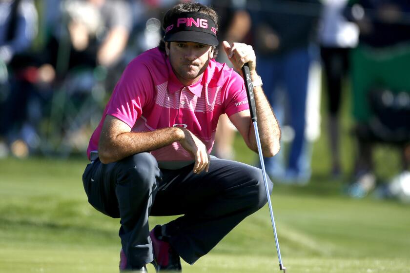 Bubba Watson eyes his putt on the second hole during the final round of the Phoenix Open.