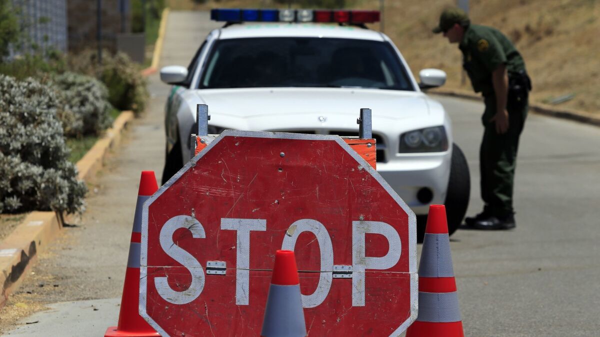 Agents staff a checkpoint on the road to the Murrieta Border Patrol facility in this 2014 photo. A man was arrested at a checkpoint in Salton City this week.