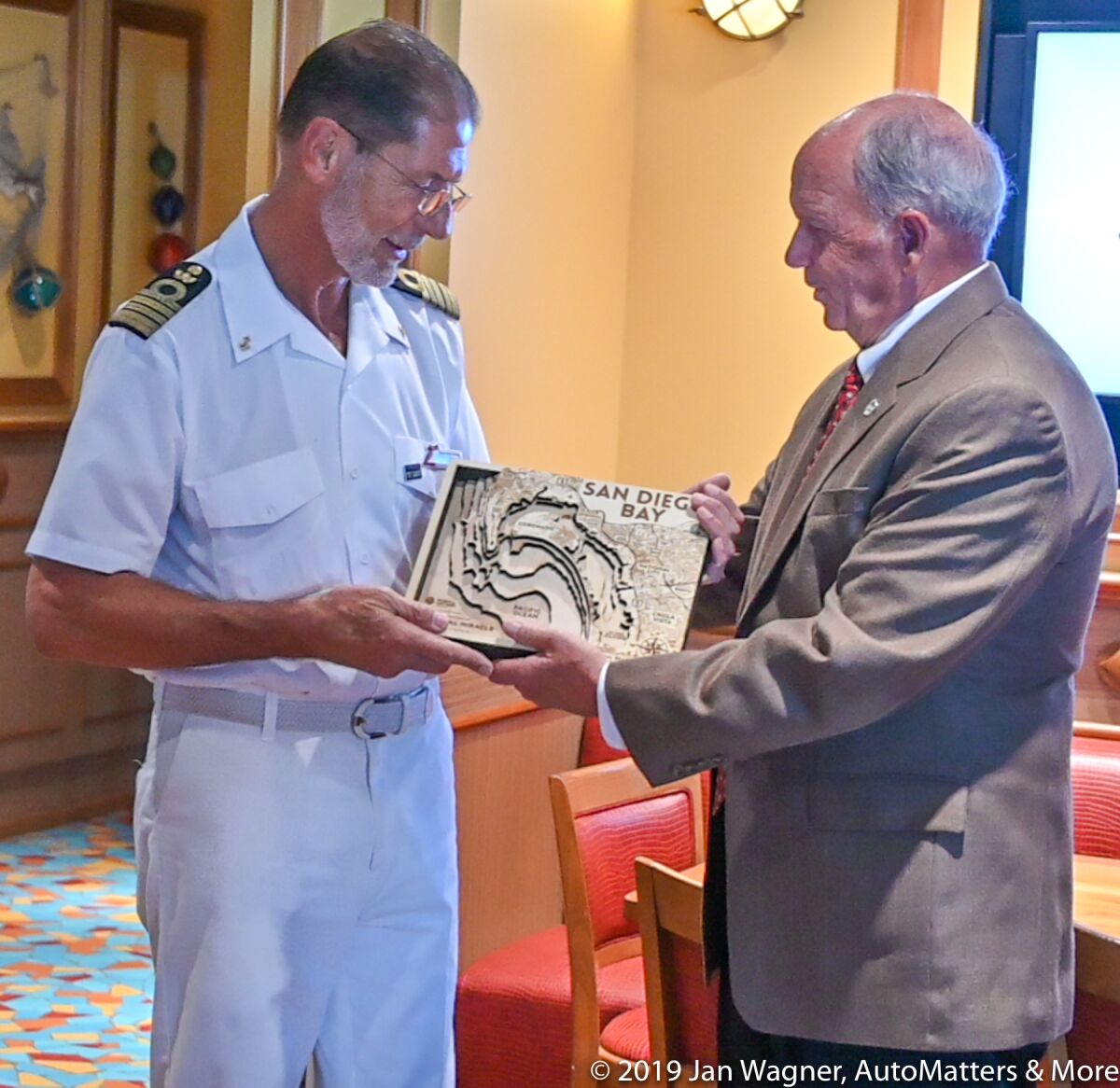 Plaque presentation by Garry Bonelli to Captain Alessandro Galotto