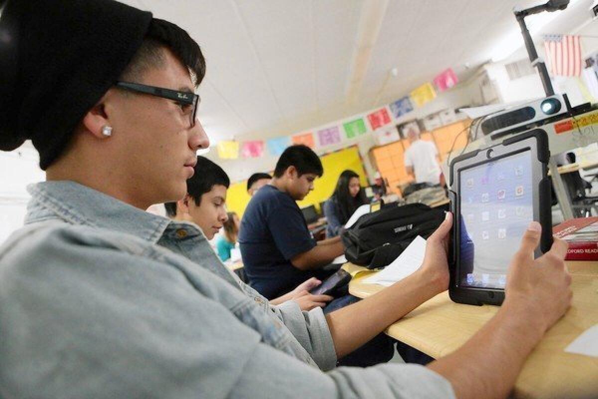 Students at Theodore Roosevelt High School receive iPads as part of L.A. Unified's program.