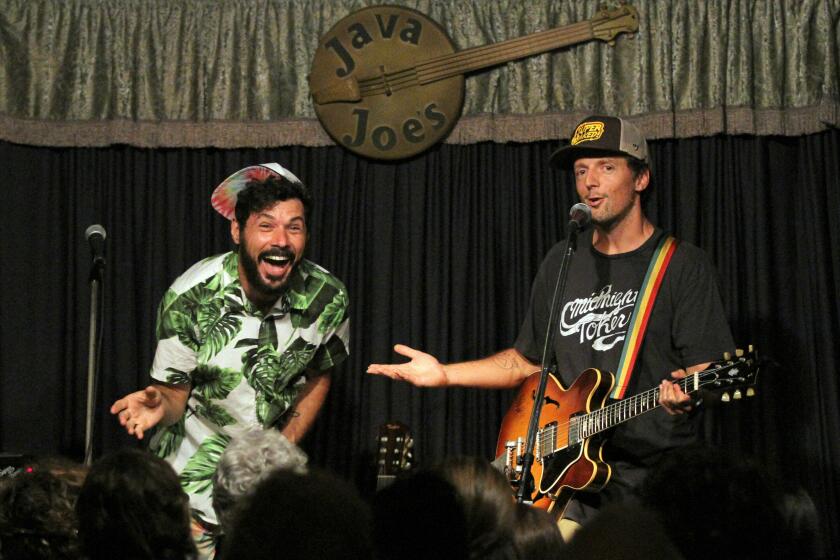 Billy Galewood, left, and Jason Mraz are shown on stage at Java Joe's
