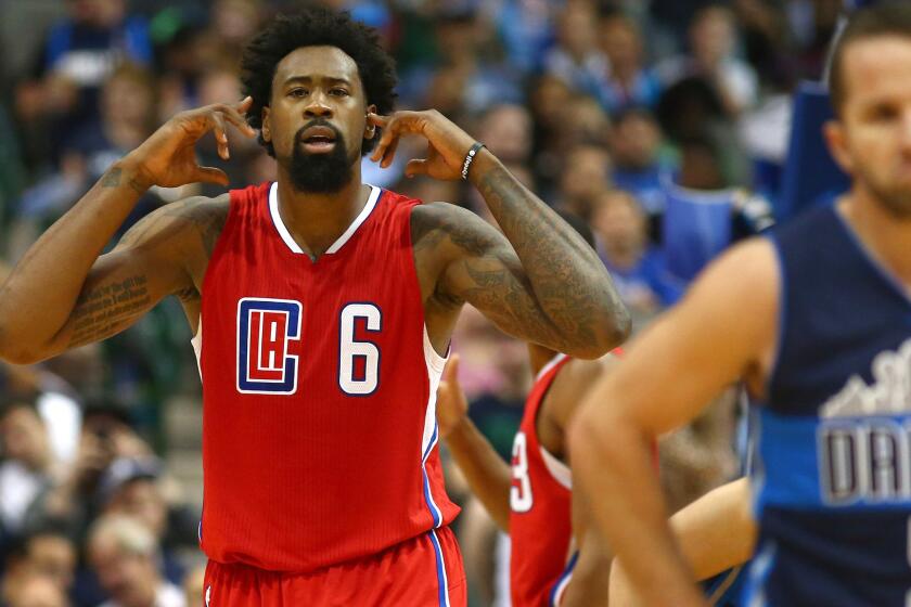 Clippers center DeAndre Jordan reacts to Mavericks fans booing him during the game on Nov. 11, 2015, in Dallas.