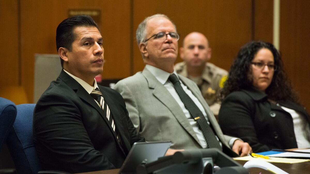 LAPD officers Rene Ponce, left, and Irene Gomez, right, listen to testimony with Gomez's defense attorney Ira Salzman during a preliminary hearing against Ponce and Gomez who are charged with covering up a crash and later filing a false police report.
