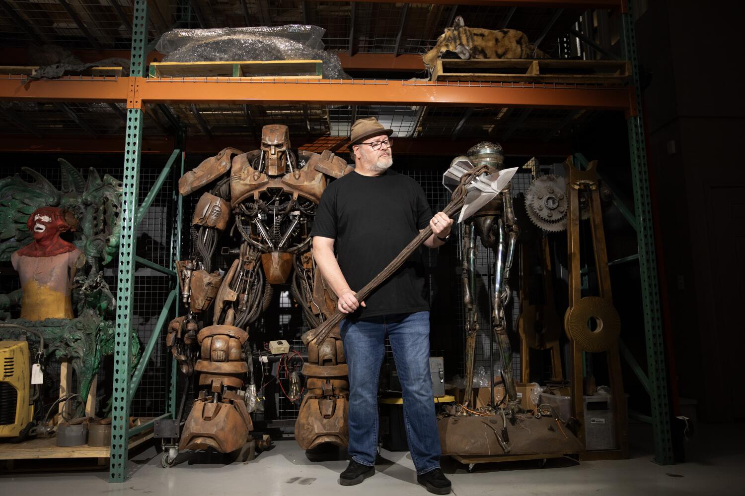 New Lenox, IL. August 15, 2025 - Dan Lanigan poses for a portrait in his studio, Cinema Relic Archives, on Friday, August 15, 2025, in New Lenox, IL.Lanigan is holding the