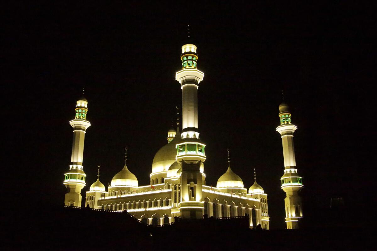 Floodlights light up the Grand Mosque in Weizhou, northwestern China.