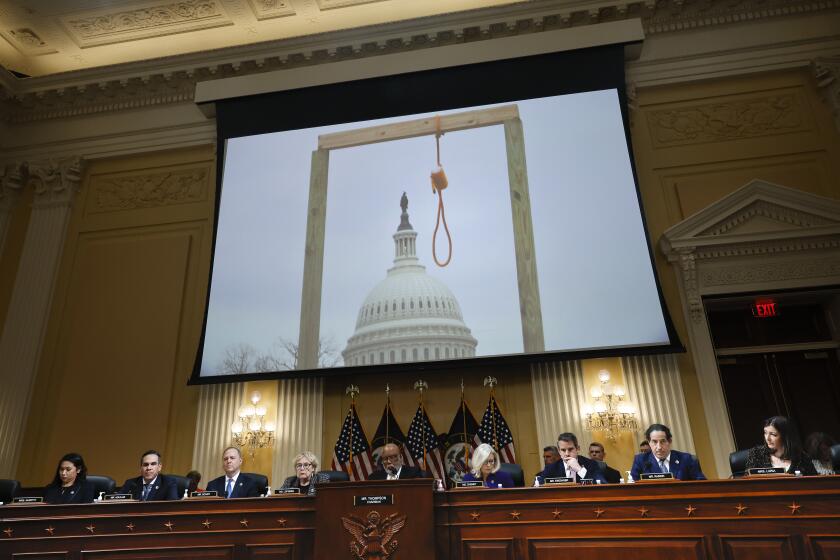 WASHINGTON, DC - DECEMBER 19: An image of a noose and gallows is displayed during the final hearing of the House Select Committee to Investigate the January 6 Attack on the U.S. Capitol, in the Canon House Office Building on Capitol Hill on December 19, 2022 in Washington, DC. The committee is expected to approve its final report and vote on referring charges to the Justice Department. (Photo by Chip Somodevilla/Getty Images)