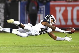 Rams safety John Johnson dives but can't interception this Oakland Raiders pass in 2018.