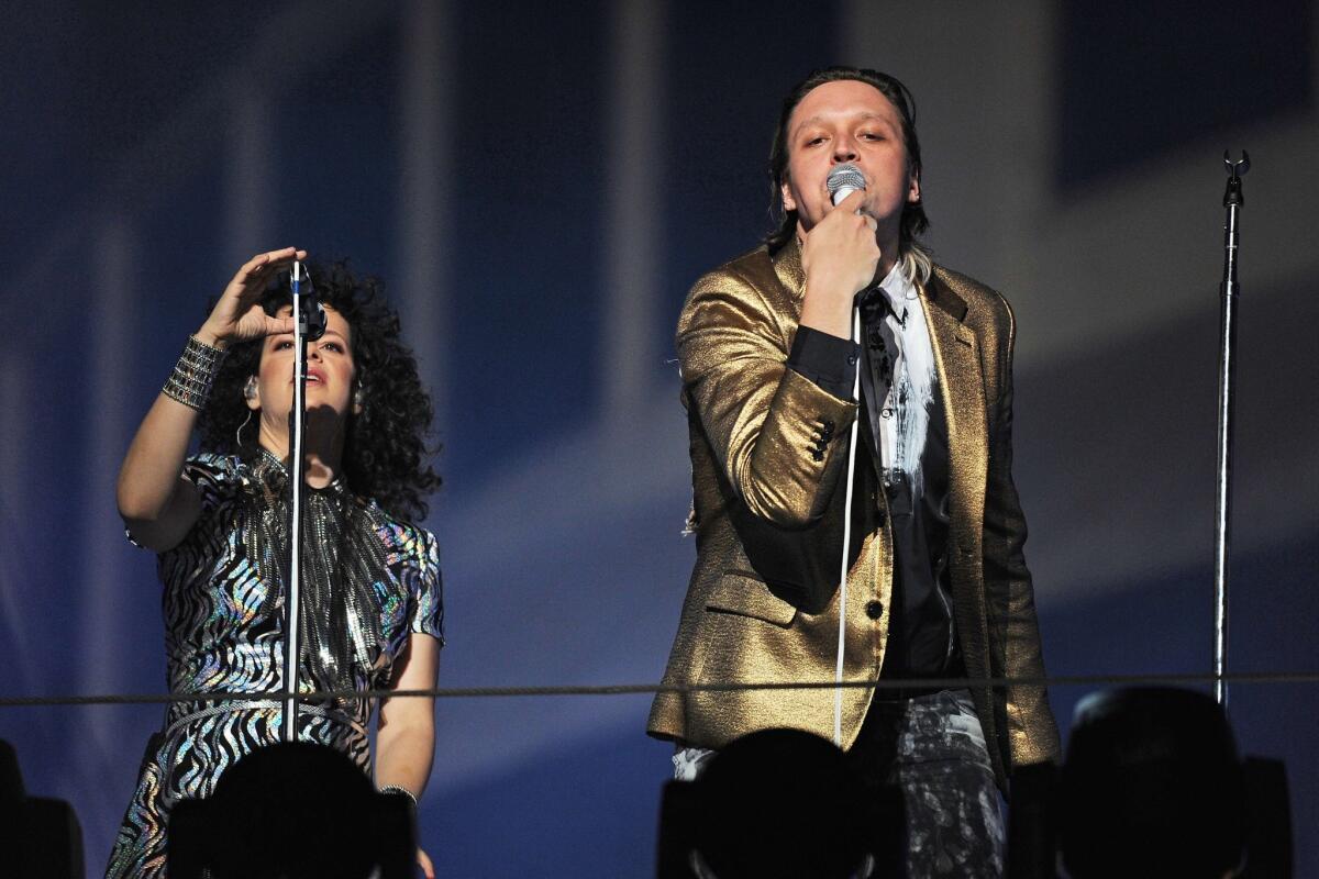 Arcade Fire, seen performing outside the Capitol Records building in Hollywood on Oct. 29, announced Thursday that it will tour North American arenas in 2014.
