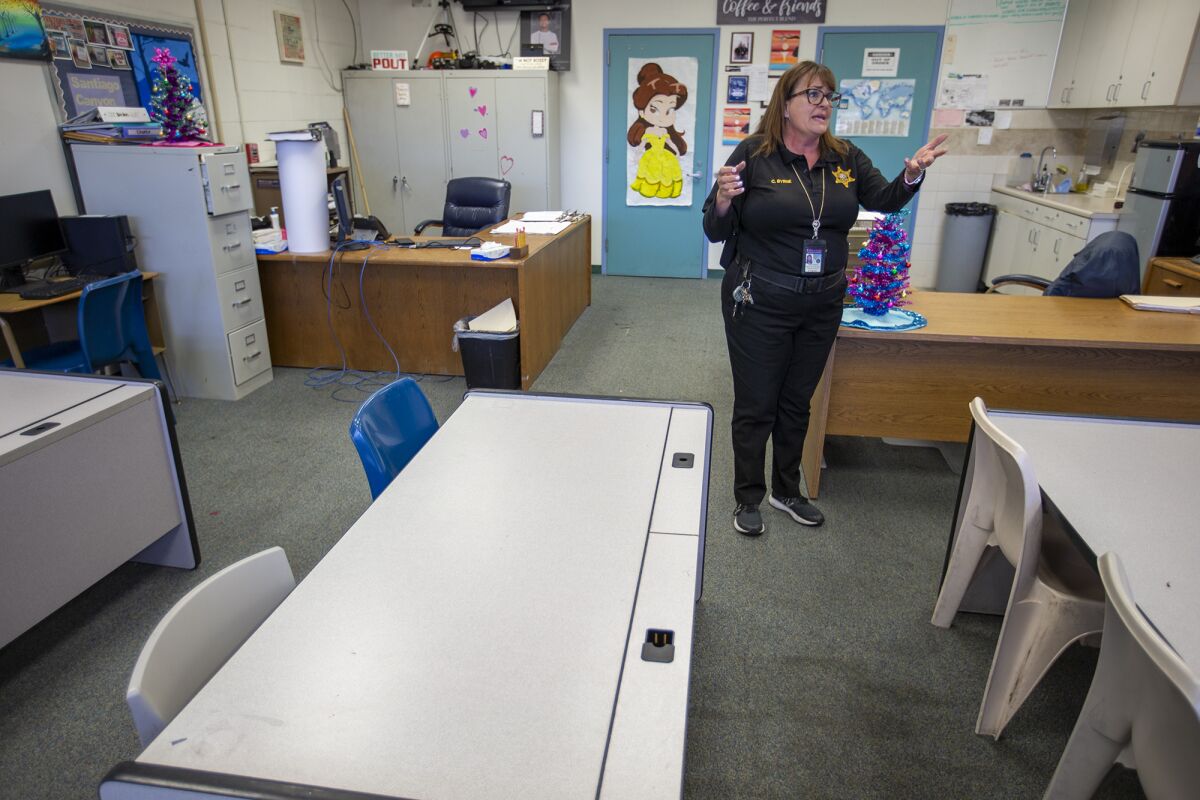 Deputy Juvenile Correction Officer Colleen Byrne shows off the old classroom at the Orange County Juvenile Hall.
