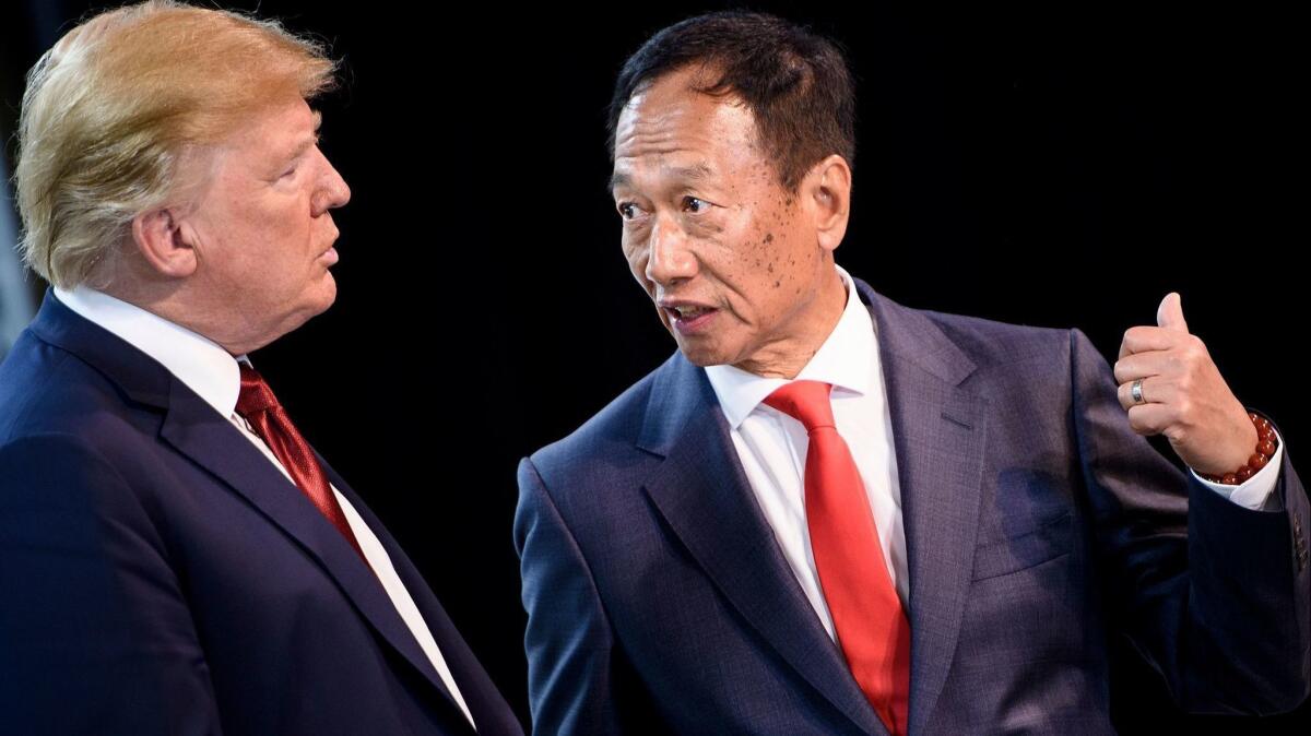 President Trump tours a Foxconn facility in Mount Pleasant, Wis., with Foxconn Chairman Terry Gou on June 28, 2018.