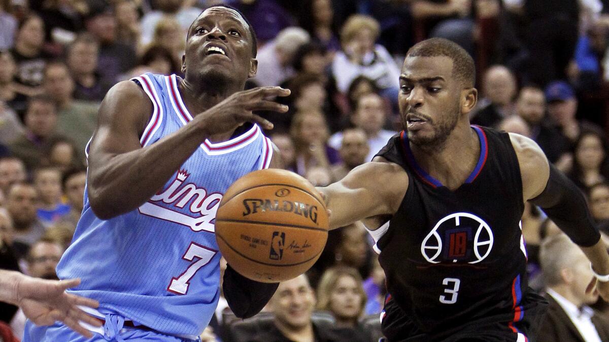 Clippers guard Chris Paul, right, knocks the ball away from Kings guard Darren Collison as he drives to the basket during the second half.