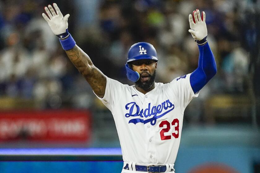 Los Angeles Dodgers' Jason Heyward celebrates after hitting a double against the Milwaukee Brewers during the fifth inning of a baseball game Tuesday, Aug. 15, 2023, in Los Angeles. (AP Photo/Ryan Sun)