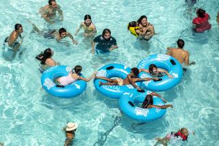 VALENCIA, CA-JULY 27, 2023:Visitors to Hurricane Harbor in Valencia cool off inside the wade pool. (Mel Melcon / Los Angeles Times)