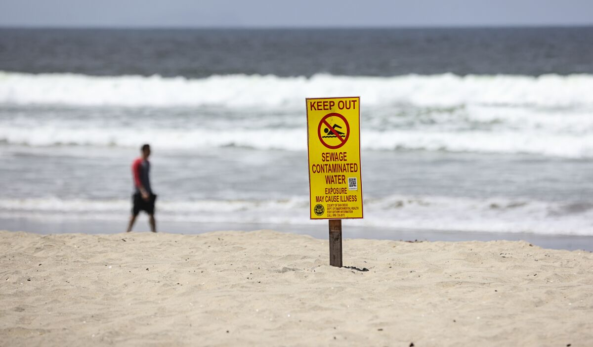 Keep Out signs warm of sewage contamination at Silver Strand State Beach on Friday, June 17, 2022.
