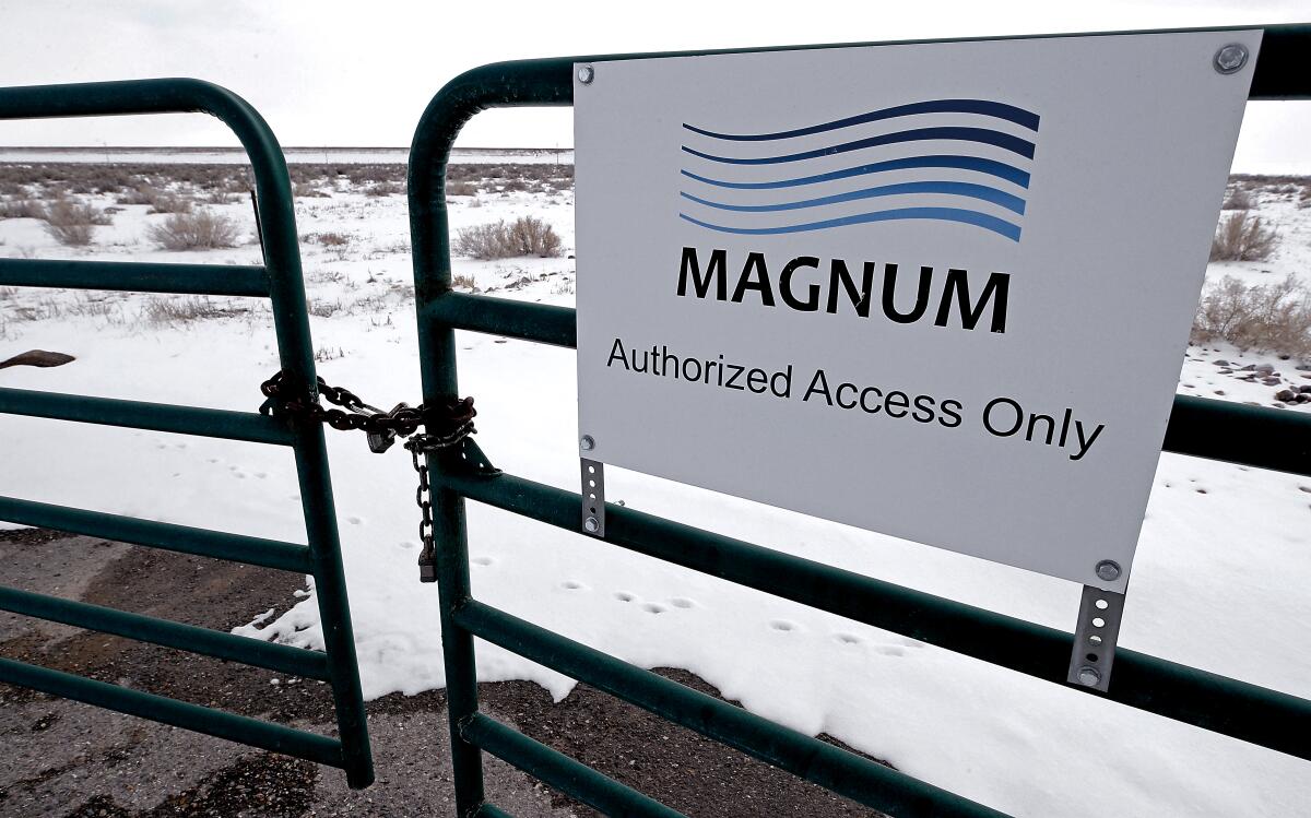 A gate blocks access to land controlled by Magnum Development across the street from coal-fired Intermountain Power Plant.